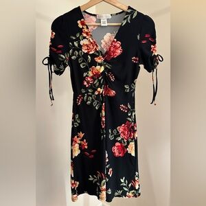 Black V-Neck Ruched Skater Dress with Red and Green Floral Design